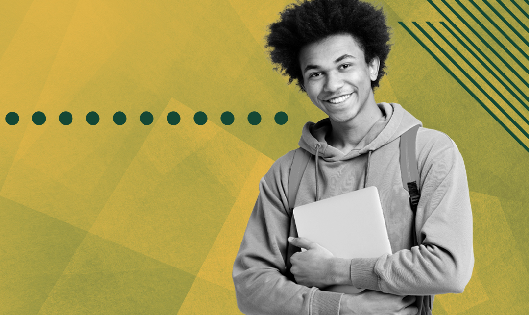 young man holding books